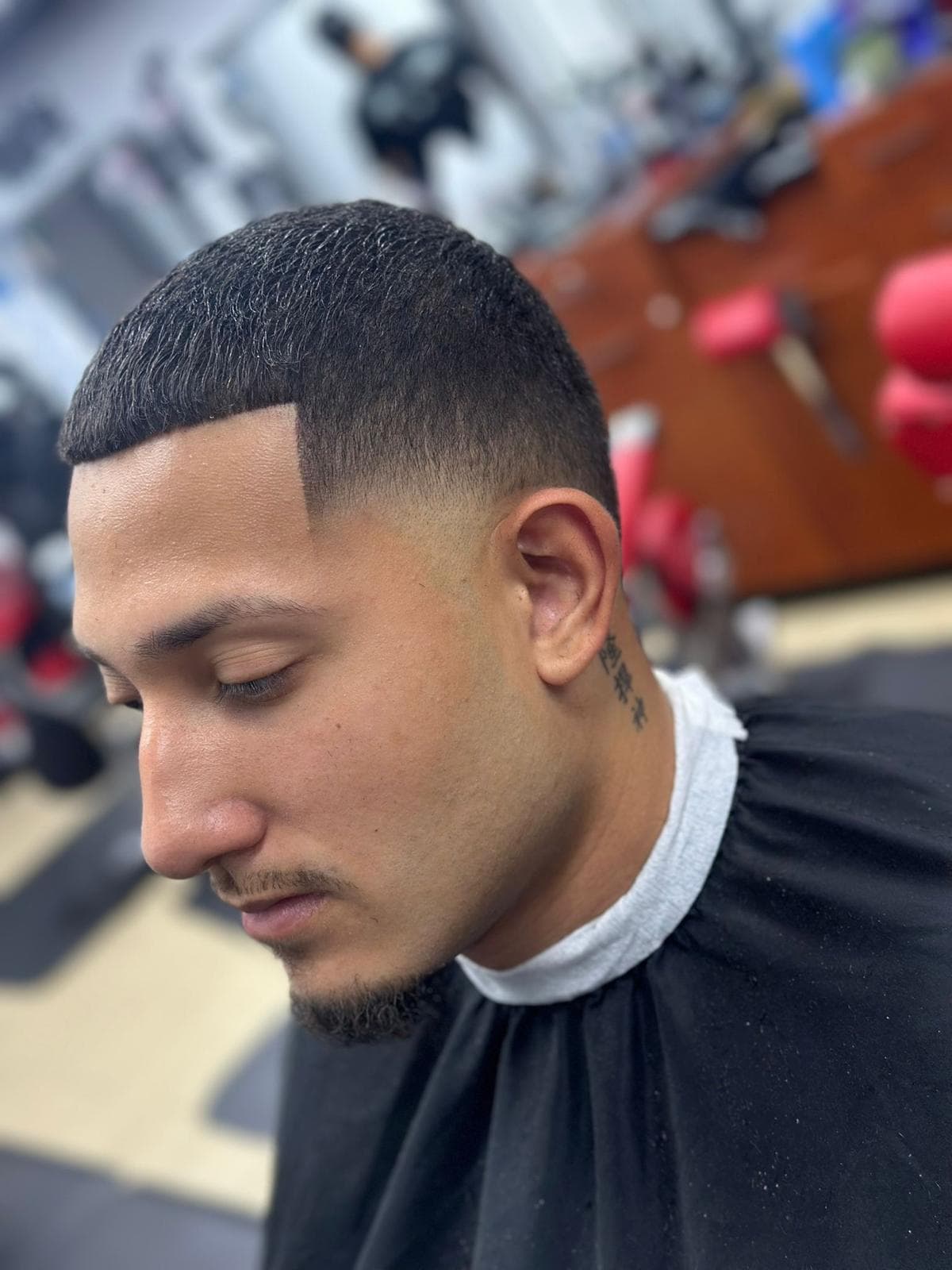 Textured buzz cut with a precise squared hairline and low fade
