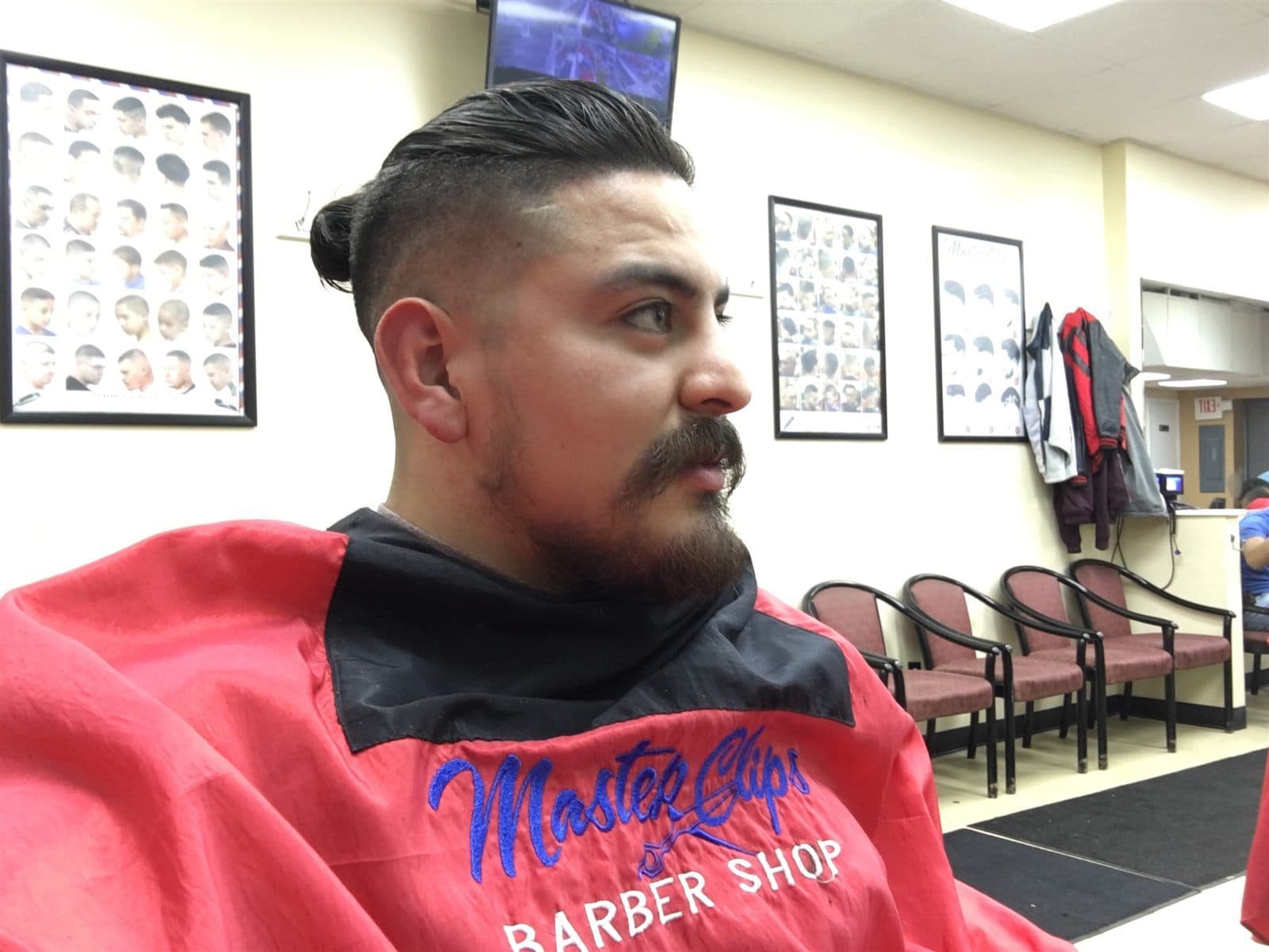 Men's undercut haircut with a styled top and short sides