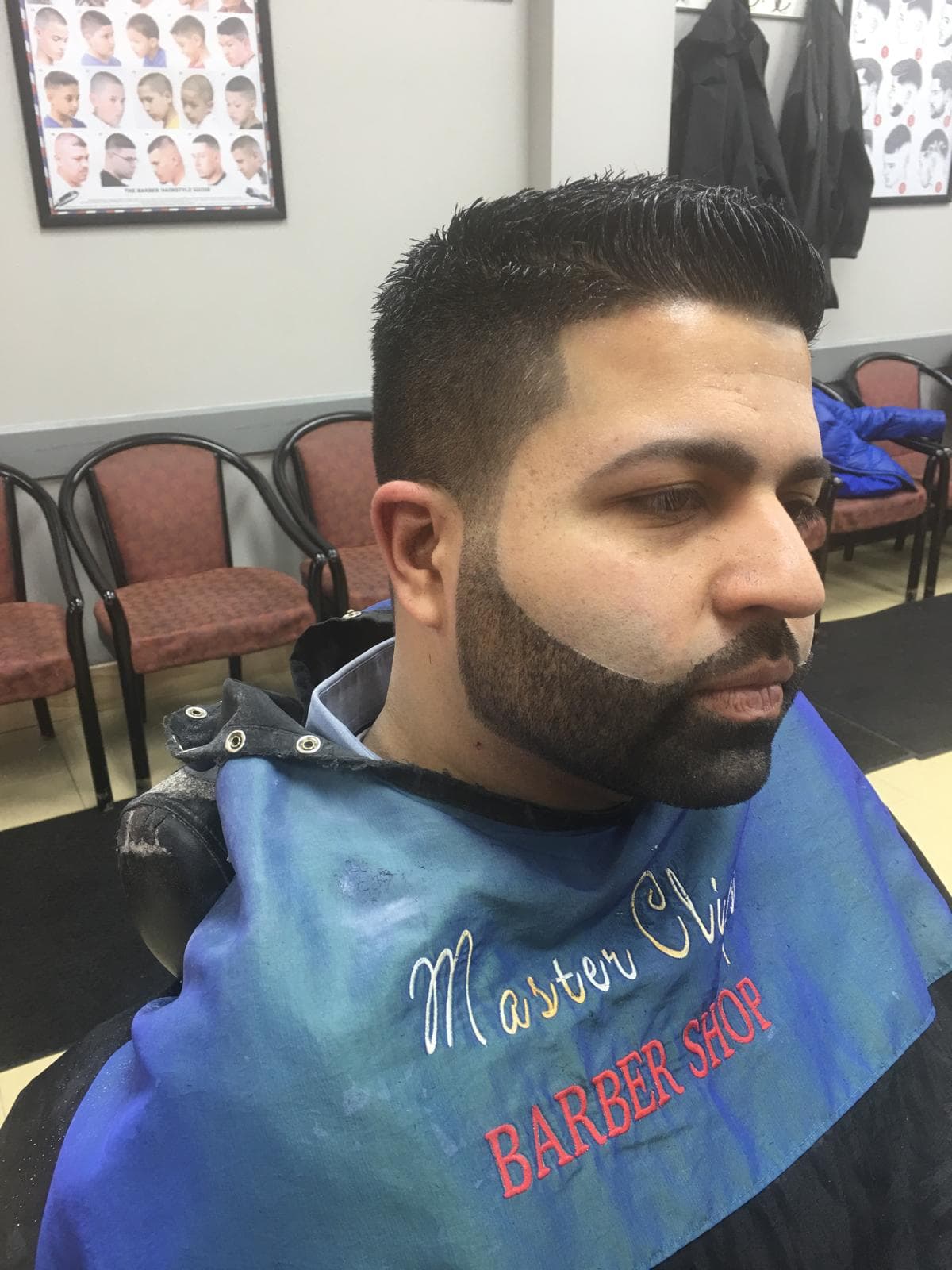 Men's styled top with a clean fade and shaped beard at Master Clips